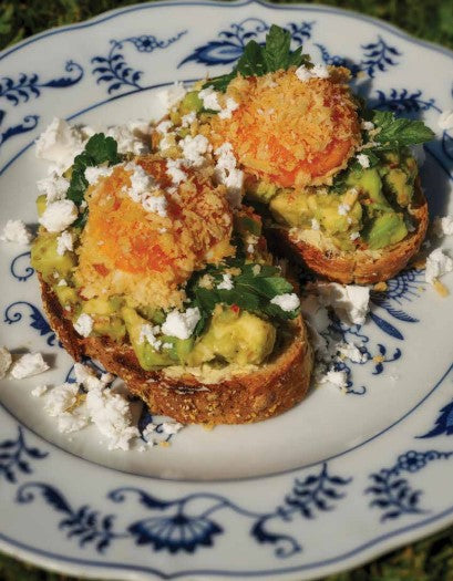 avocado and feta toast with crumbed egg yolks